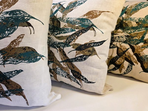 Linen cushion cover featuring hand screen-printed Australian eucalypt fallen leaves illustration