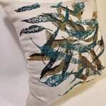 Close-up of hand screen-printed Australian eucalypt fallen leaves on linen cushion cover