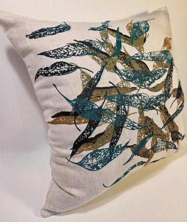 Close-up of hand screen-printed Australian eucalypt fallen leaves on linen cushion cover