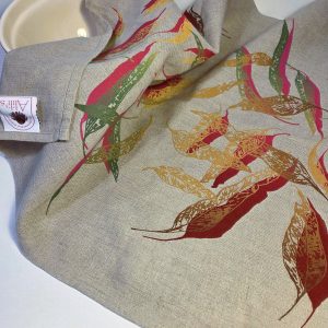 Linen tea towel featuring hand screen-printed eucalypt fallen leaves