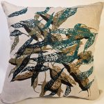 Cushion cover displayed in home with hand screen-printed Australian eucalypt fallen leaves design