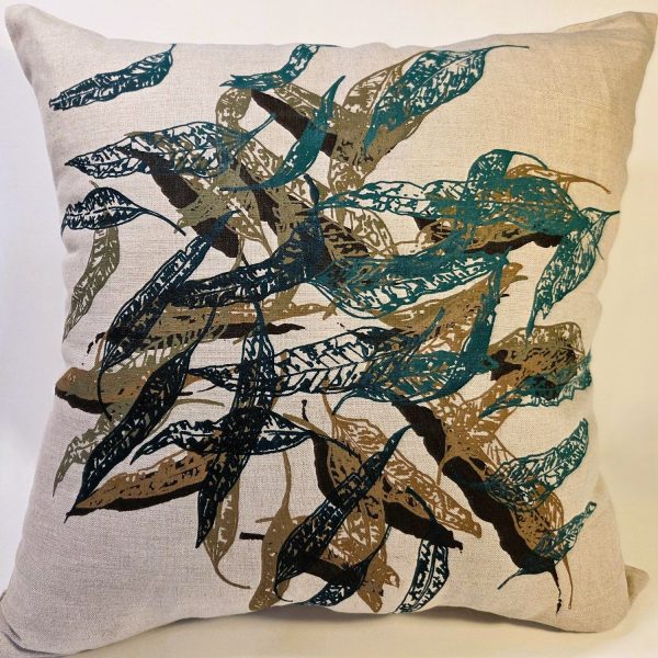 Cushion cover displayed in home with hand screen-printed Australian eucalypt fallen leaves design