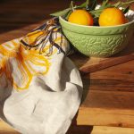 Linen tea towel featuring hand screen-printed passionflower illustration