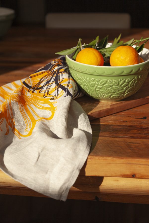 Linen tea towel featuring hand screen-printed passionflower illustration
