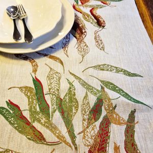 Hand screen-printed linen table runner with Australian Eucalypt Fallen Leaves design