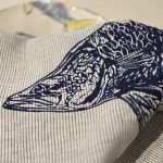 Hand screen-printed linen tea towel with Australian barramundi design